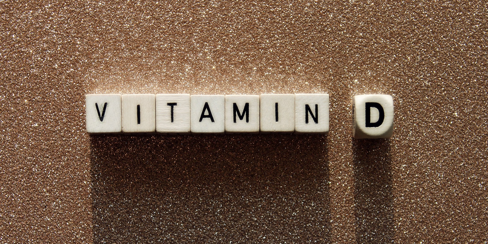Schriftzug Vitamin D mit Buchstaben auf Würfeln dargestellt